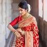 This image features a traditional Red Banarasi Silk Sari, a classic choice widely celebrated for bridal wear, weddings, and formal festive occasion