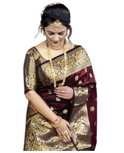 The ensemble shown in the image is a Wine Maroon Banarasi Soft Silk Saree featuring intricate golden zari work.